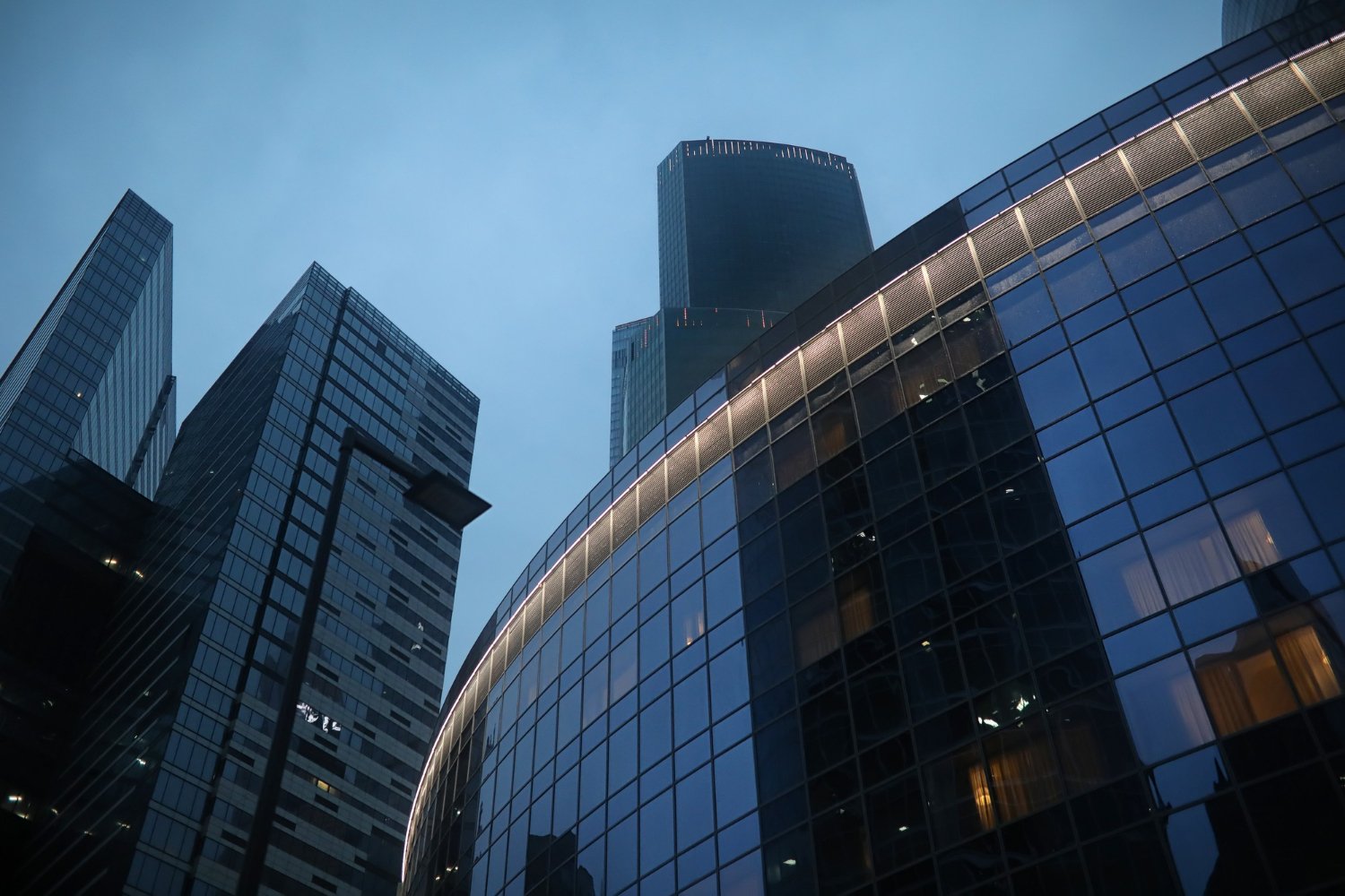 Modern corporate buildings representing a UAE holding company structure