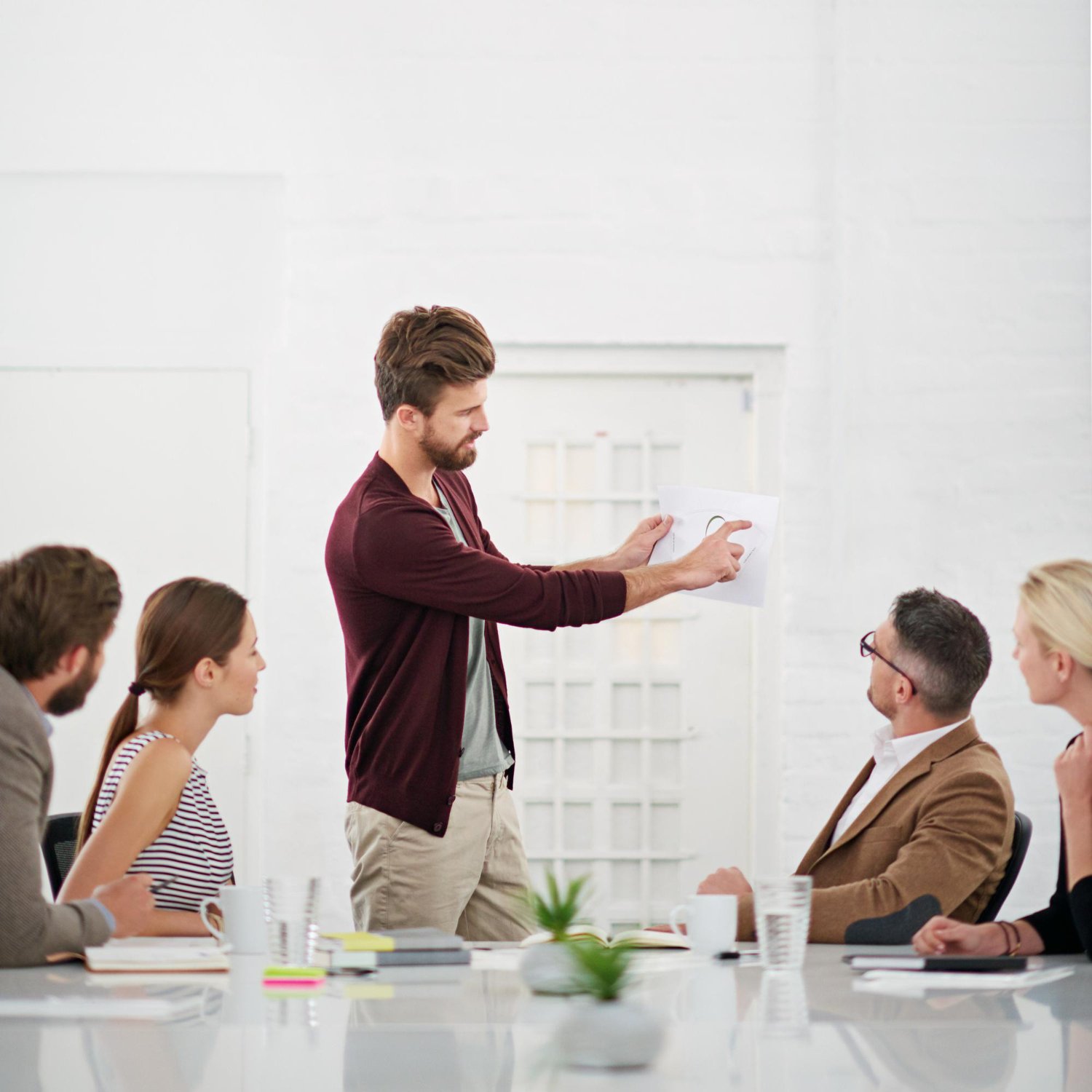 Team reviewing documentation in a meeting