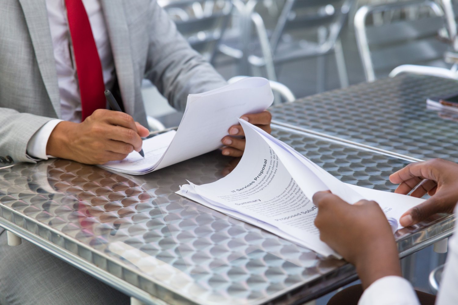 Business representatives reviewing renewal documents